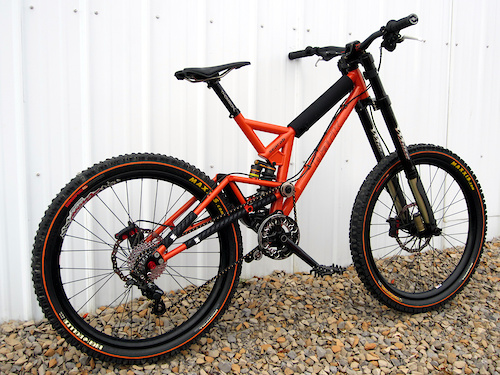 *FRAME: Dark Cycles Scarab  w/ Avalanche Chubbie 8.75x2.75 offset bushing
*FORK: White Brothers Groove 200 DH 
*WHEELS: Arrow Racing DHX rims laced to Atom Lab Pimplite hubs W/ DT spokes
*TIRES:  Maxxis Mobster 2.7 F High Roller 2.5 R orange line
*BRAKES:  Maguar Gustav DH 210 F / 190 R
*SHIFTER:  Shimano Zee 10
*R/DER:  Shimano Zee 10 Rear Derailleur   
*CASSETTE: SRAM 10 speed 11-32 Cassette PG1070
*CHAIN: Connex 10s Black Gold 
*CRANKSET: Profile Racing 170 w/ 4 bolt spider
*CHAINRING: RaceFace DH 36t 
*GUIDE: Dark Cycles w/ bash ring Envy
BOTTOM BRACKET: Profile Racing external
*SEATPOST:  Thompson Elite 30mm black
*SEATPOST CLAMP: Woodman Deathclamp 
*SADDLE:  WTB High Tail Ti
*GRIPS: Intense Lock On, Straitline endcaps black  
*BAR:  Chromag Fubars OSX 25mm Rise and 780, 31.8 Black Tight Orange
*STEM: Dark Cycles Cog &amp; Ax 31.8mm  
*HEADSET: Works Components 1 Deg
*CABLES &amp; HOUSING: Jagwire L3 
*PEDALS:  Dark Cycles Arachnid Pedals