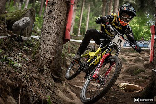 Connor Fearon using every inch of track to smooth out the big rocks and roots.