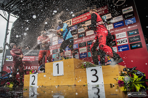 The hardest rain of the day fell on Martin Maes in the form of champagne from atop the podium.