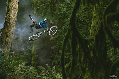 Graham Agassiz throwing a top side no can shot in the Bellingham jungle for Dakine.