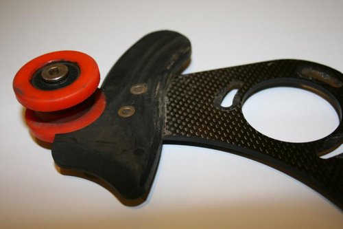 Top roller and anti-friction guide