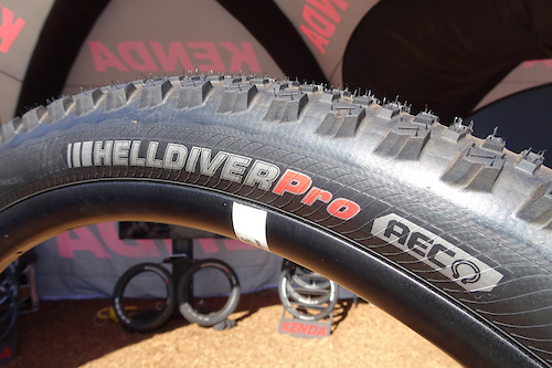Kenda Helldiver Pro: Kenda is back on point with a competitive range of enduro and gravity tires. The Helldiver is their fast-rolling hard-condition flat-top design. This one uses their AEC (Advanced Enduro Casing), which has three nylon bands: two on the sidewalls and a finely woven anti-puncture band under the tread.