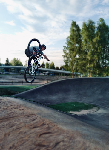 No better way to misuse a bmx racing track than popping tricks out of the slanted walls of the bumps.