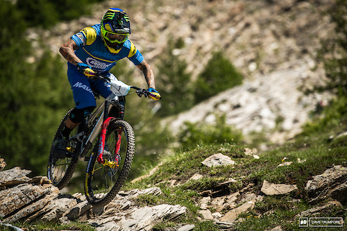 Sam Hill skimming over the sharp rocks on Stage 7