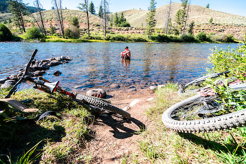 A soak in the river with a cold beer is the perfect way to end a long ride.