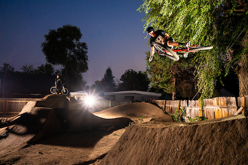 Jason Schroeder rides the dirt jumps in Austin Smiths back yard in Boise, Idaho