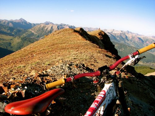 My bad ass ride and Jeff at the summit of red lady