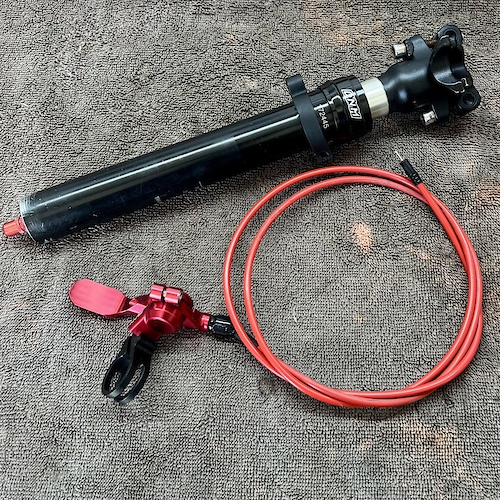 Dnm dropper seatpost with remote online lockout