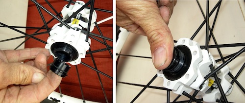 Put a tiny amount of grease inside the hollow axle and then slip the endcap into the axle with the short end facing outwards. Push it in firmly by hand until the flange sits flush with the end of the axle. Repeat on the opposite side.