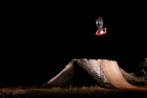 Fronty over the trick jump at night under the flood lights.