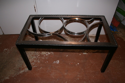 A coffee table I made using old steel bike rims.  No glass in it yet