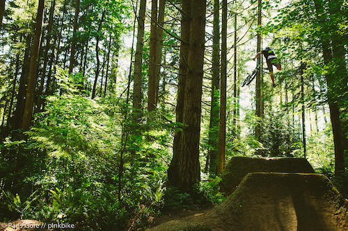 Steven Bafus tail whipping the massive step up at the Jungle Trails. Photos do no justice on how big this jump is.