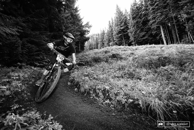 Craig Parker enjoying the final stage of the 2013 Oregon Enduro Series race.  This section has been used for DH races from 20 years at Ski Bowl.  It's not super technical as it winds back and forth between tree lines but it is possible to wash out in a corner and lose time.