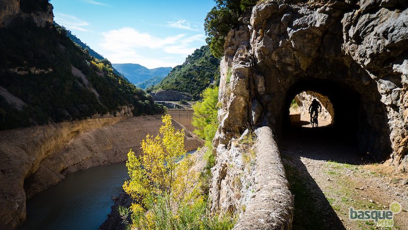 Riding through the old tunnels cut into these canyon walls.