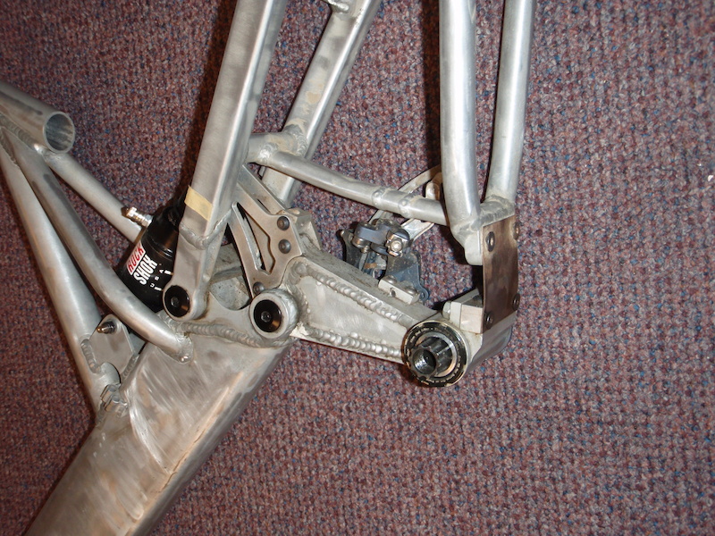  paint scraper proto type from 1999-2000 Hand made by Jim Busby. Jim used the paint scraper blade because he could change the angle of the link which adds reduces chain growth.