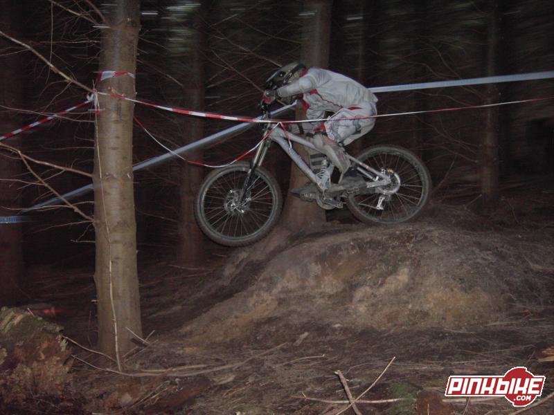 Pretty decent pic of a rider just into the bottom wooded section on a small drop!