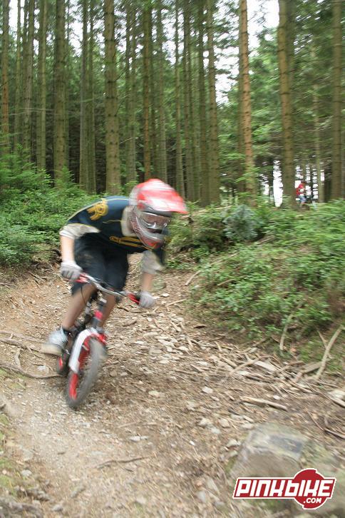 me riding the natural berm on the lil kids bike! i was actually surprising fast, but it didnt have a working  back brake