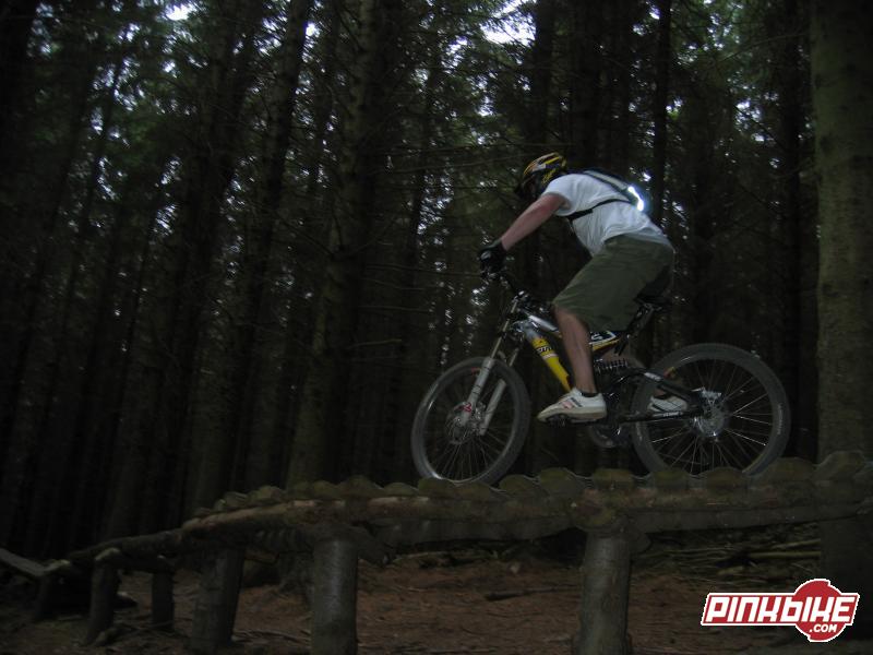 riding the small bit of north shore in the ewok village on black route at Glentress