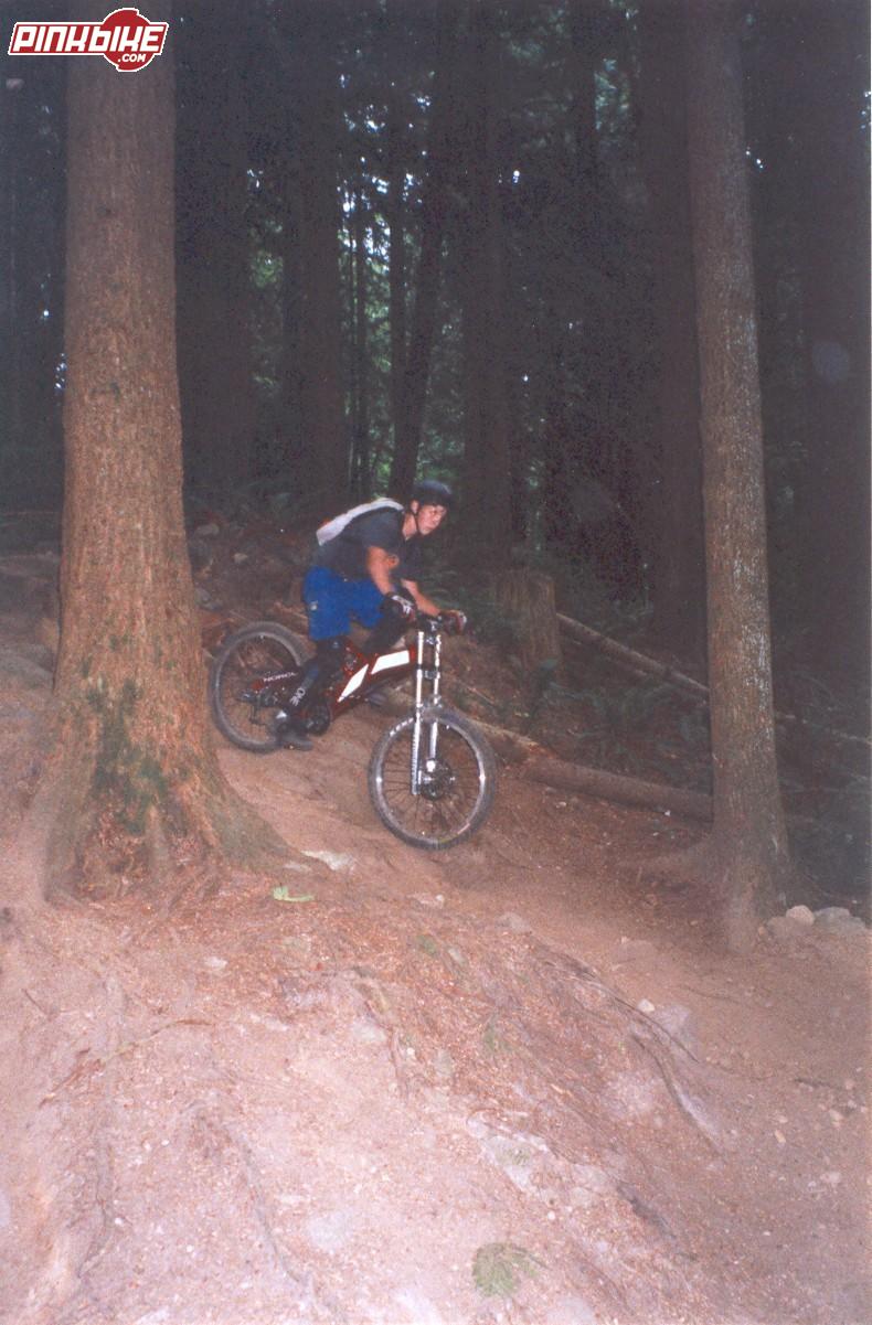jesse riding down a semi steep section at the bottom