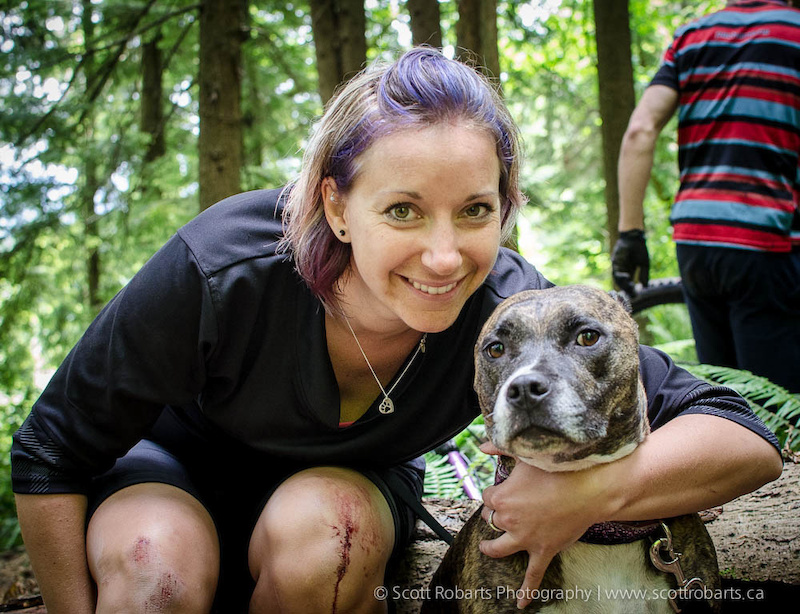 Smiling despite the bloody knees - Veronica with her dog Chanel. BC Enduro Series - North Vancouver