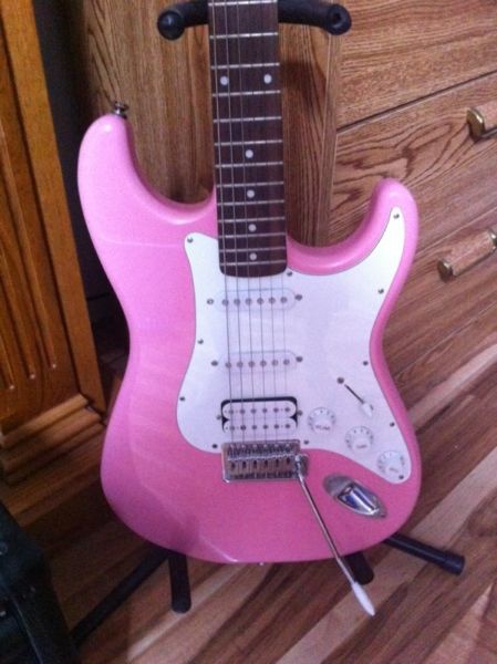 0 Pink and white Austin electric guitar