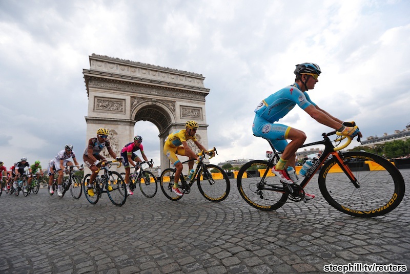 Vincenzo Nibali joins an elite club: 6th rider to win all 3 Grand Tours. First Italian in 16 years
to win the Tour. Marco Pantani last won in 1998... The pack of riders including race leader Astana team rider Vincenzo Nibali of Italy cycles near the Arc de Triomphe at the end of the final 21st stage of the Tour de France cycle race in Paris 137.5 km final stage of the 2014 Tour de France cycling race, from Evry to Paris Champs Elysees, July 27, 2014.     REUTERS/Jean-Paul Pelissier (FRANCE  - Tags: SPORT CYCLING)   - RTR40B3Y