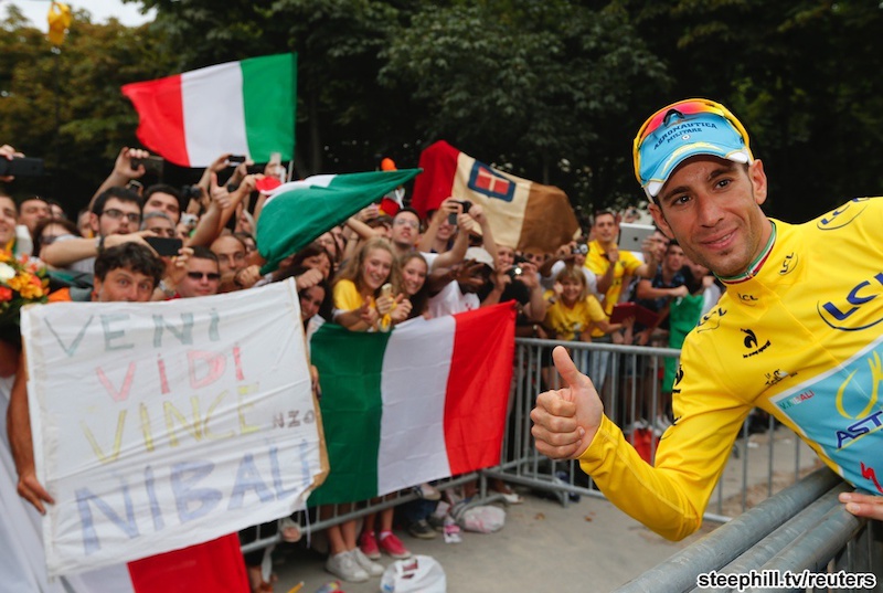 Vincenzo Nibali joins an elite club: 6th rider to win all 3 Grand Tours. First Italian in 16 years
to win the Tour. Marco Pantani last won in 1998... Astana team rider Vincenzo Nibali of Italy gives thumbs up as he celebrates his victory with Italian supporters after the 137.5 km final stage of the 2014 Tour de France, from Evry to Paris Champs Elysees, July 27, 2014.        REUTERS/Jean-Paul Pelissier (FRANCE  - Tags: SPORT CYCLING TPX IMAGES OF THE DAY)   - RTR40B3Q
