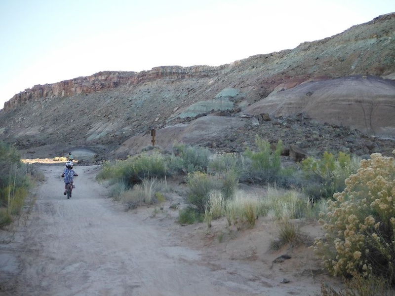 Klondike Bluff trail in Moab, UT is a great trail for kids. It is about 3 mi. up, and 3 mi. back with dino tracks along the way to keep them motivated for the small climbs:)