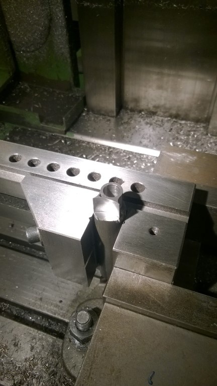 Machining small sea tpost binder parts.  My wife referred to them as "frog spectacles."  Makes more sense when you see the finished product.
