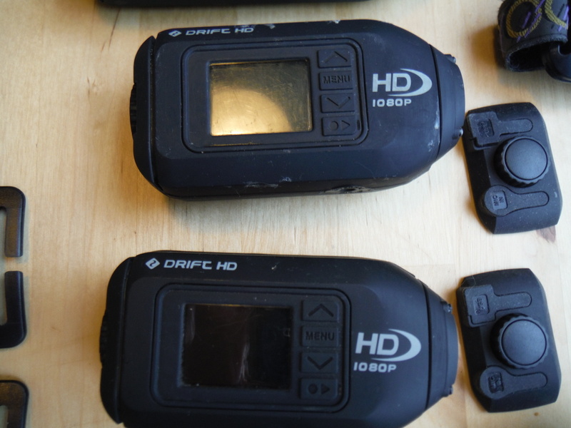 0 3 Drift HD Helmet Cams plus spare batteries and mounts: $200