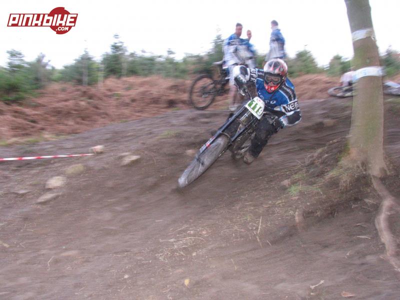me hammering the last berm before the drops at speed looking like i meen business look at the dodgy front wheel angle team stood behind watching