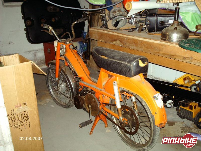 Orange moped rear view