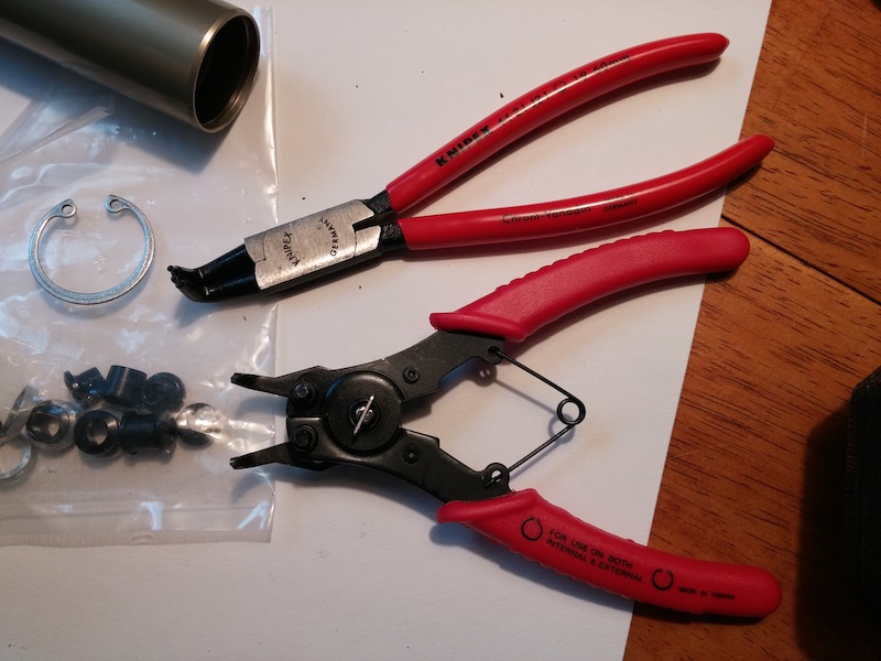 I will say a good pair of snap ring pliers is a necessary shop tool!

I've used the lower interchangable pair a few times and it absolutely refuses to remove internal snap rings due to poor construction of the tips. Now the Knipex has no problem at all! Snap rings go off and on in about 2 seconds flat.