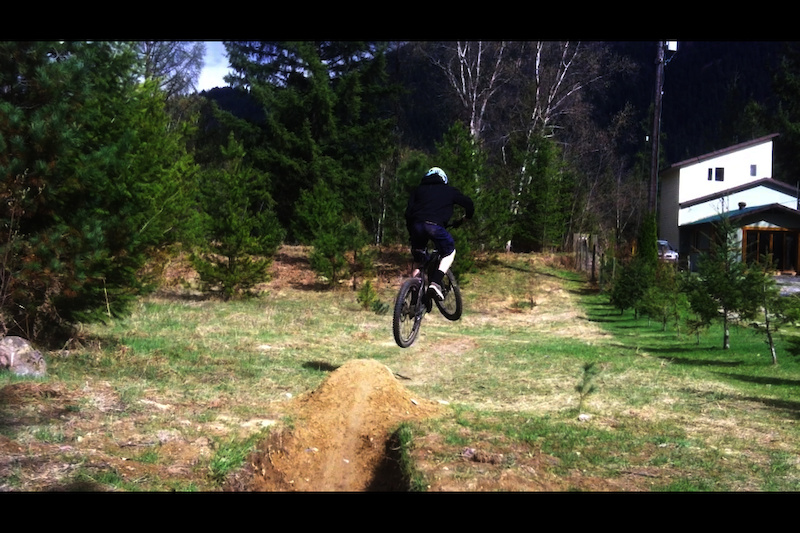Hitting one of my jumps in my front yard (not my best...no whips in the photo..but I thought it looked pretty sick, and had style)