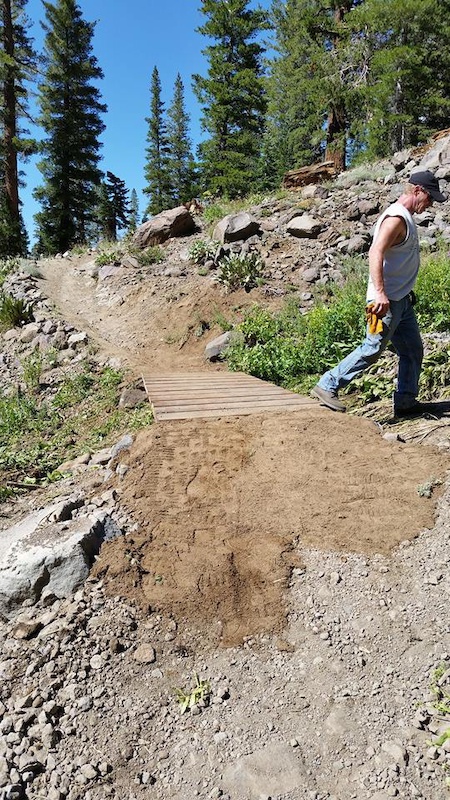 Rebuilding the Vista trail after a flash flood destroyed most of it.  Finished bridge over new gully