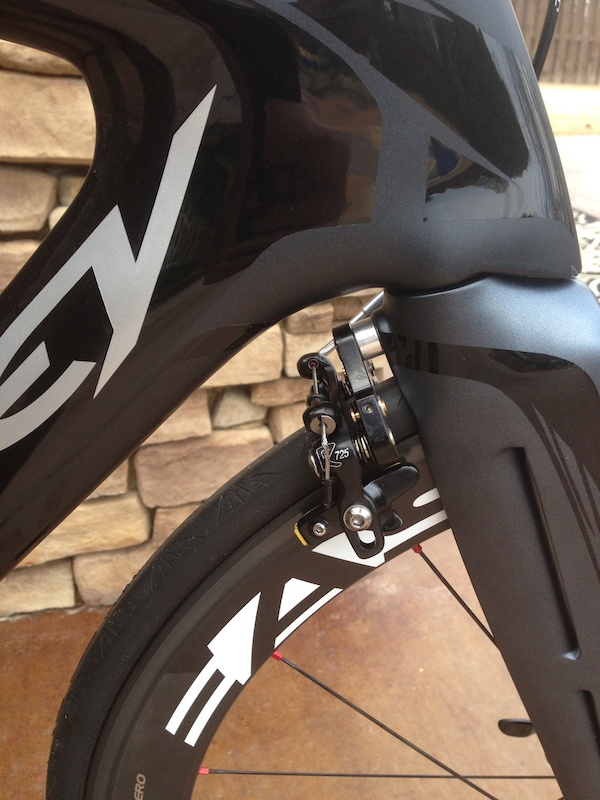 Front end view of front brake tucked behind fork