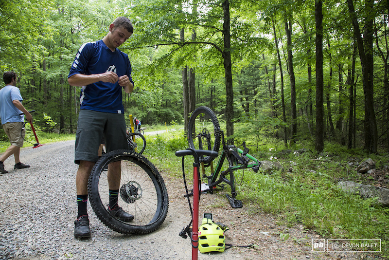 An unfortunately common scene on the day for many racers. Cody Phillips repairs a flat at the bottom of stage three.