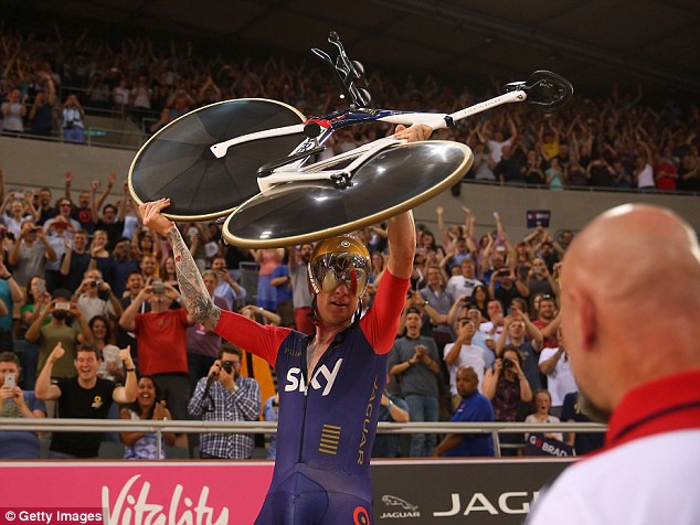 Wiggins had enough energy left to lift his bike above his head in celebration.

Read more: http://www.dailymail.co.uk/sport/othersports/article-3114493/Bradley-Wiggins-sets-new-hour-record-33-80-miles-London.html#ixzz3cQgOcSsW 
Follow us: @MailOnline on Twitter | DailyMail on Facebook