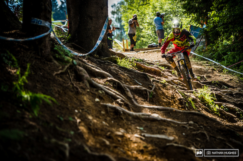 The off-camber roots into the last woods are where riders find out just how comfortable they are outside of their comfort zones with plenty of buck-wild action. Dean Lucas tames the beast.