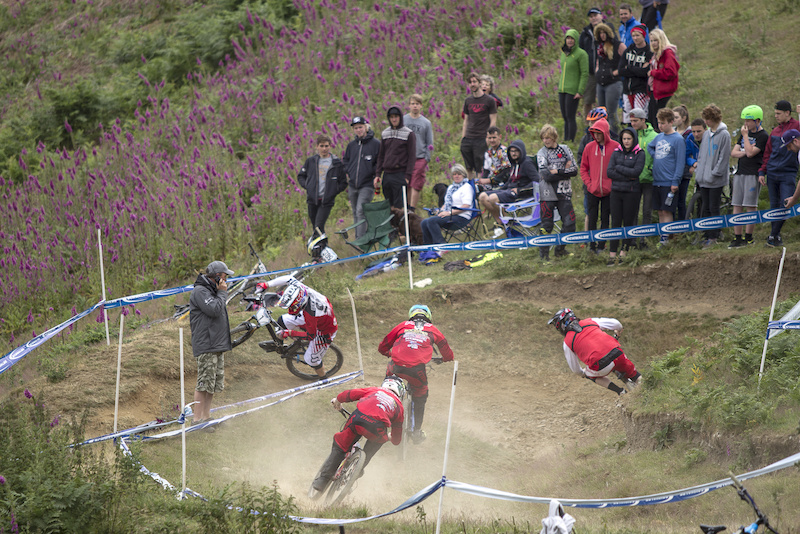 Scott Beaumont leads out Paul Bakewell and the Hudson brothers into the bowl type hairpin during The Schwalbe British 4X National Championship at Moelfre Hall, Moelfre, United Kingdom. 11July,2015 Photo: Charles Robertson