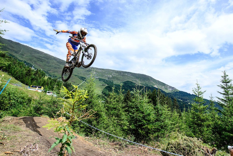 Contestants race down the downhill track of the Bikepark Serfaus-Fiss-Ladis during the Kona MTB Festival Serfaus-Fiss-Ladis.ROOKIES in Tyrol Austria on August 10 2014. Free image for editorial usage only Photo by Felix Schueller.