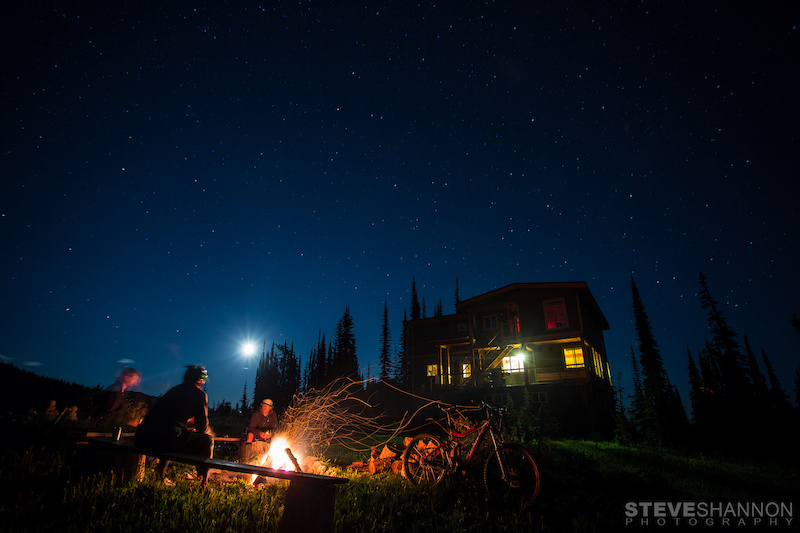 Matt Yaki Jordie McTavish and Rylan Kappler around the fire after a long day of mountain biking at Sol Mountain Lodge in the Monashee mountains.