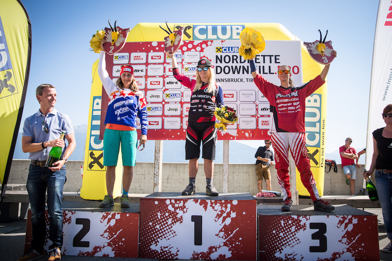 Second placed Elke Rabeder L of AUT event winner Tracy Hannah C of Australia and third placed Simone Wechselberger R of AUT celebrate with their trophies during the the Nordkette Downhill.PRO in Innsbruck Austria on August 29 2015. Free image for editorial usage only Photo by Sebastian Schieck.