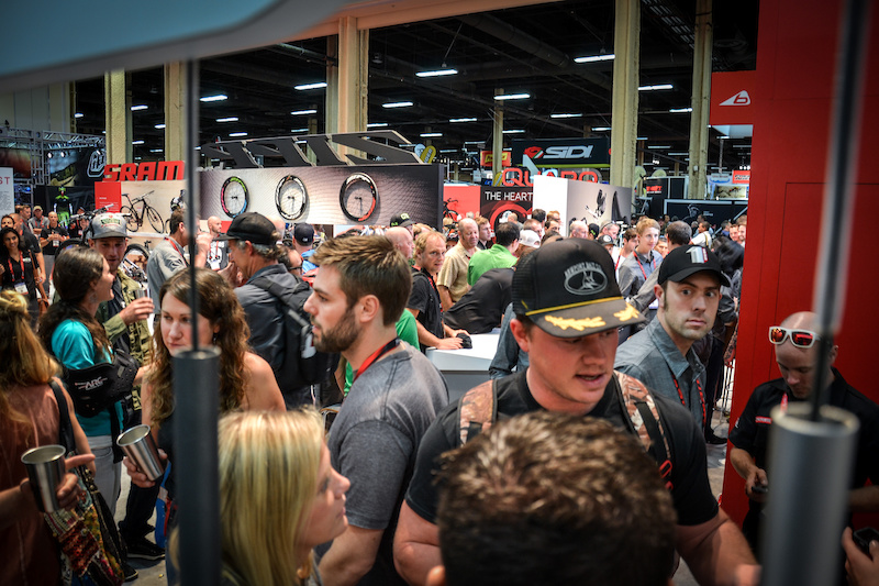 The melee at the SRAM booth. Turns out people like free beer ad free swag.