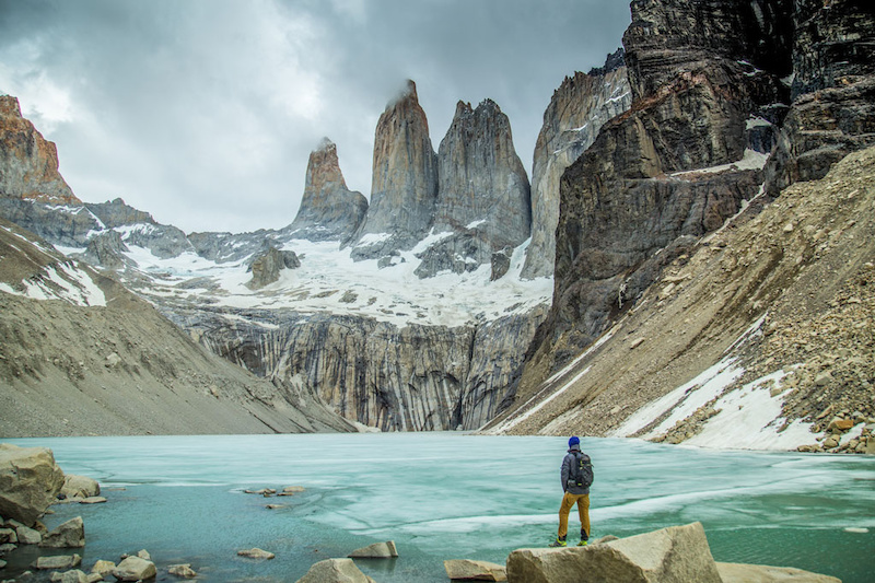 Feeling small, in the shadow of the Torres del Paine, after hiking to the base of the famous towers in Patagonia