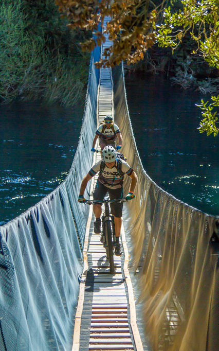 Having fun on the suspension bridges in Huilo Huilo bio-reserve in Chile