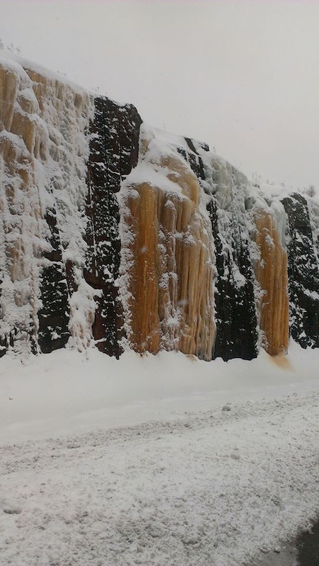 Check this out...Looks like glasier ice on a 100 ft. rock cut, Hwy. 11 North
 just south of N.B....must be copper or iron in some of the viens to give them the different hue's ??/
 pix just don't do it justice of how amazingly beautiful this is to behold in person smile emoticon !!*