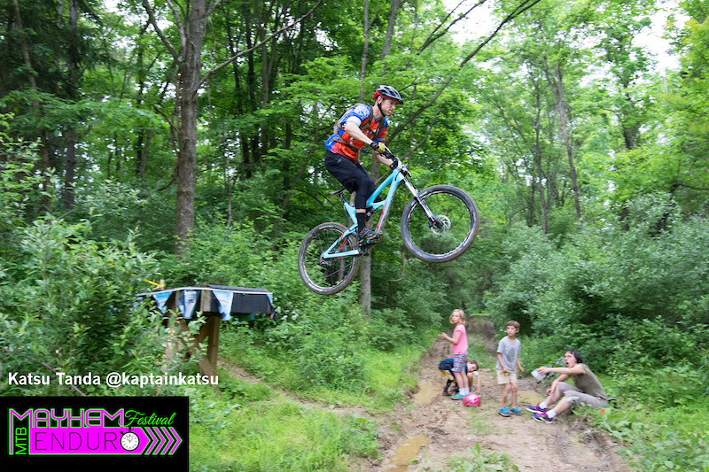 A rider soars over the road gap on the first stage of the Mayhem Enduro in Cumberland Ohio on May 29 2016.