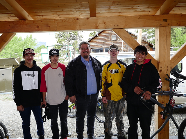 Kha Shade Heni (Chief) of the Carcross Tagish First Nation visits with the members of the Singletrack to Success trail crew.