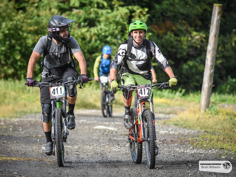 The transition stages are an opportunity to chat with new friends here Paulo Valle of the United States chats with Chad Hendren of Canada during the SRAM Canadian Open Enduro Crankworx Whistler 2015. Photo by Scott Robarts .